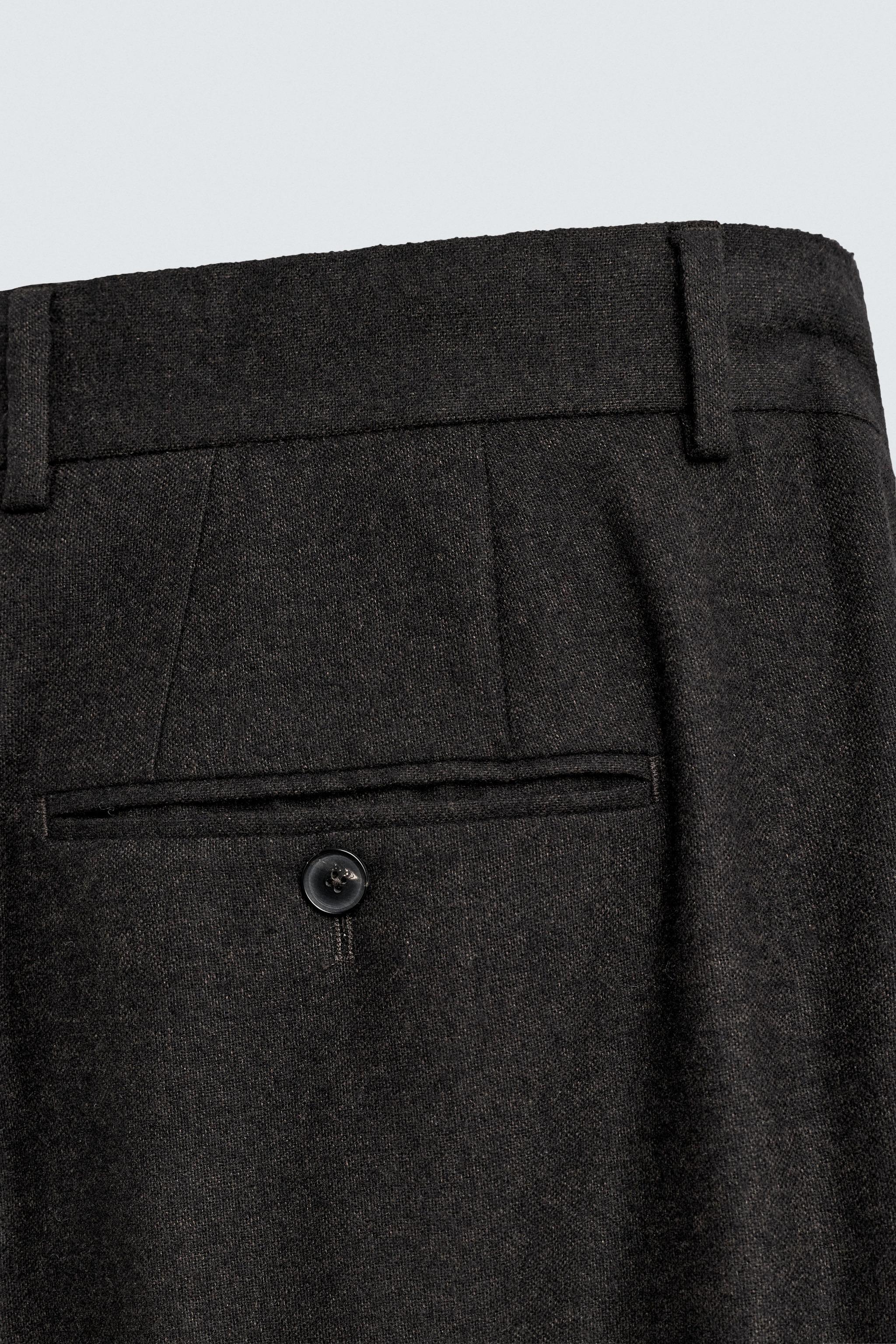 LIMITED EDITION PLEATED WOOL PANTS